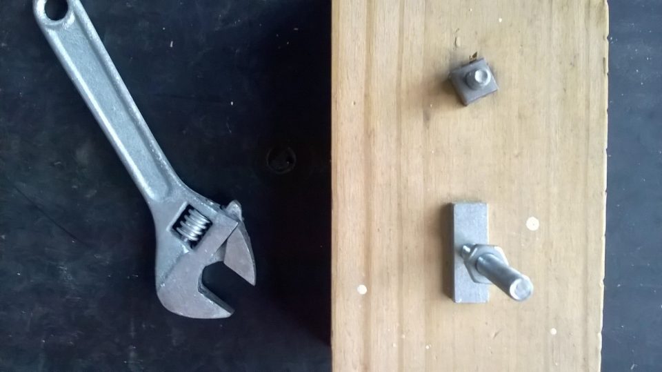 Kid and family recyling project salvaging hardware, Nuts bolts screws